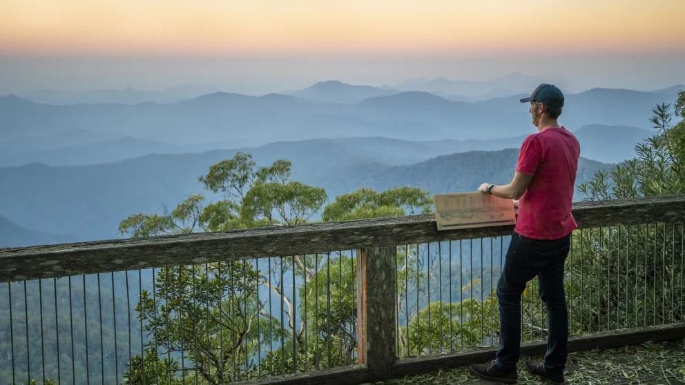 Visitor at a mountain lookout in New England National Park