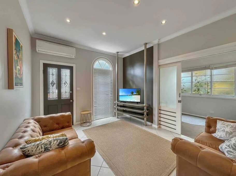 Living room with garden-facing windows at Brightside Apartment 2